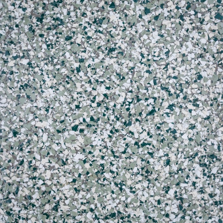 This image shows an abstract pattern of various shades of broken glass pieces, with different shapes, predominantly in white and green tones.