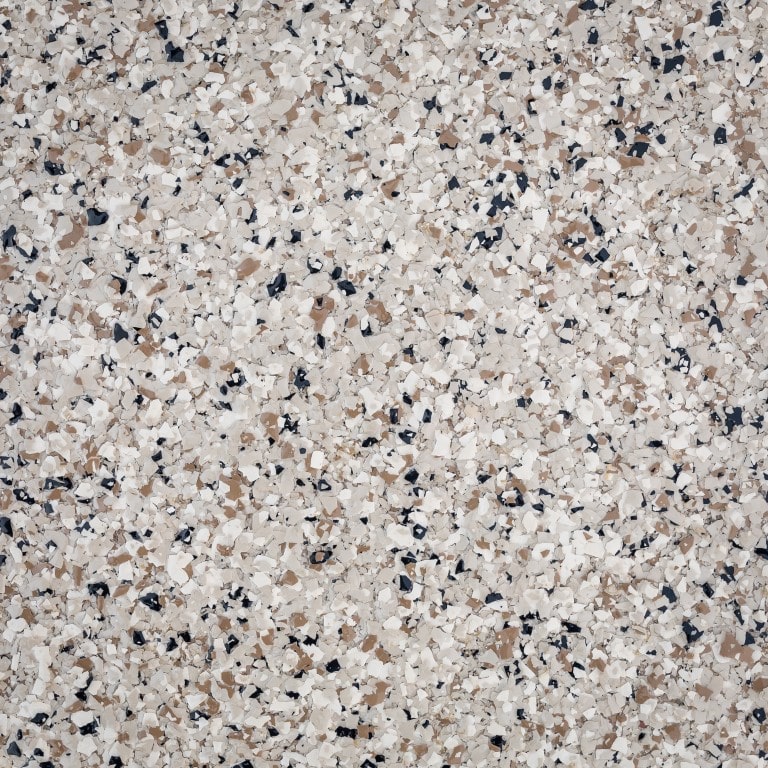 This image shows a close-up texture of terrazzo flooring with a speckled pattern of beige, brown, black, and white fragments.