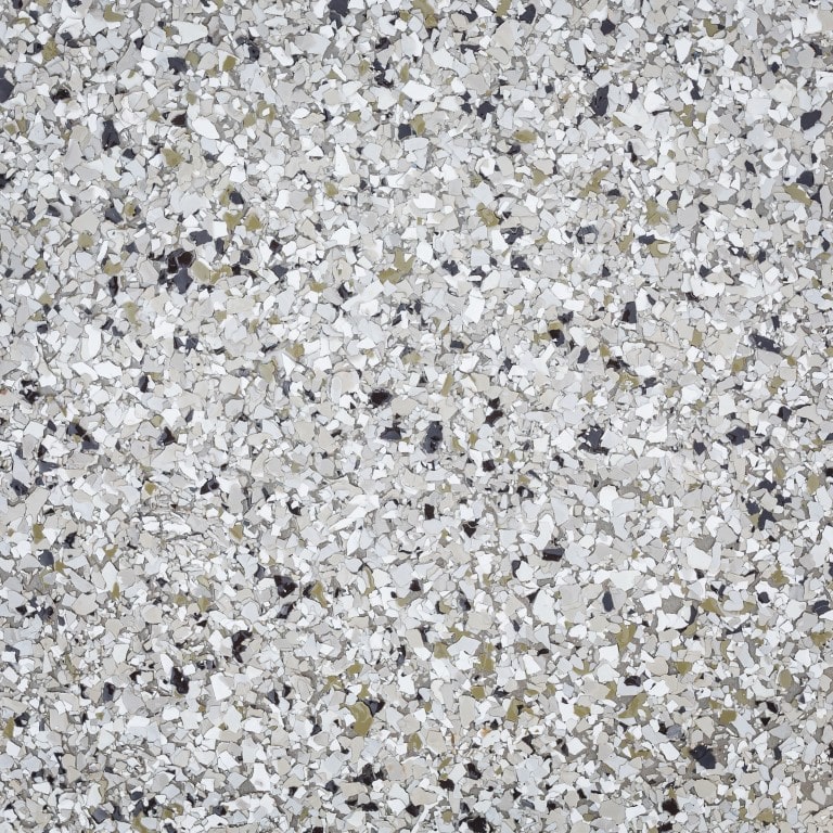 This image shows a close-up of a terrazzo surface with a composite of gray, white, and yellow fragments in a speckled pattern against a light background.