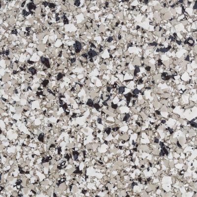 This image shows a close-up view of speckled granite, with a mix of black, white, and gray fragments creating a coarse, mottled surface.